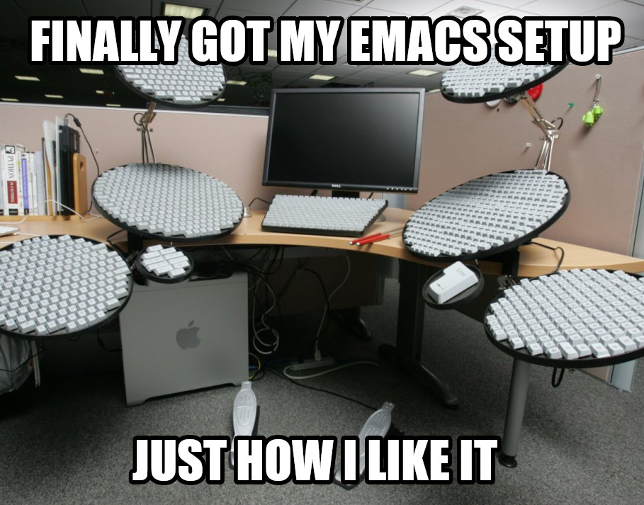 Desktop computer with 6 giant oversized keyboards, caption "Finally got my Emacs setup just the way I like it"